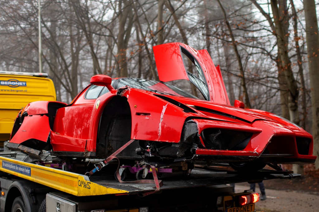 Wrecked Ferrari on tow truck.